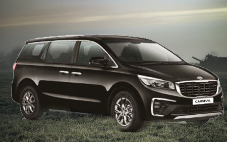 Snowboarder performing a trick against a snowy Mt. Buller backdrop.